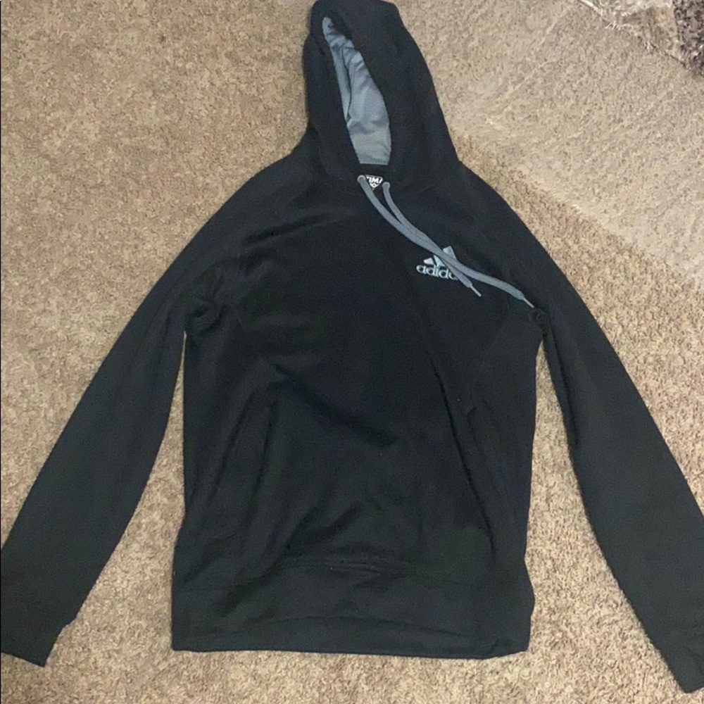 Black hoodie with grey emblem